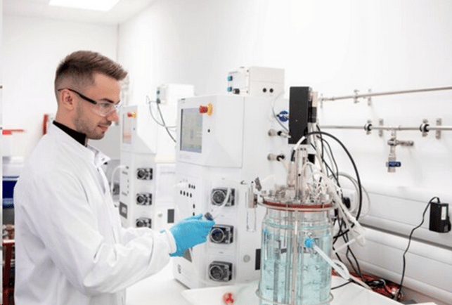 Scientist using laboratory equipment